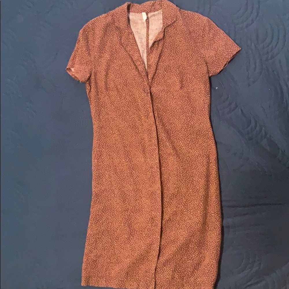 A tight button up, brown polka dot dress.